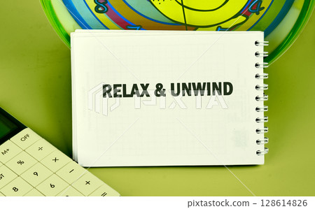 The conceptual phrase RELAX AND UNWIND. The concept of beauty and health The conceptual phrase RELAX AND UNWIND. The concept of beauty and health 128614826