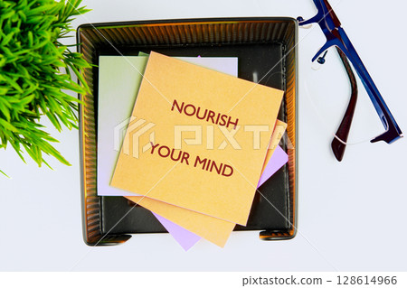 The concept phrase NOURISH YOUR MIND. The concept of beauty and health, balanced lifestyle concept The concept phrase NOURISH YOUR MIND. The concept of beauty and health, balanced lifestyle concept 128614966