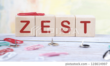 The concept word ZEST is assembled from wooden cubes. emphasizing motivation and creativity concept The concept word ZEST is assembled from wooden cubes. emphasizing motivation and creativity concept 128614997