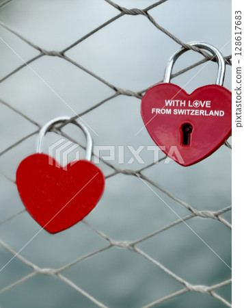 Heart-shaped love locks on a Swiss bridge 128617683