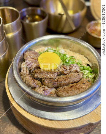 Korean-style beef bowl topped with egg yolk (bibimbap) Korean-style beef bowl topped with egg yolk (bibimbap) 128617801