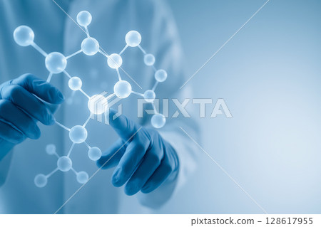 Scientist wearing gloves interacts with molecular structure model representing deoxyribonucleic acid scientific research lab focused medicine pharmaceutical technology and genetic health care 128617955