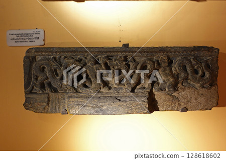 A relief depicting a scene from the life of the Buddha from a Gandharan Buddhist sculpture on display at the museum in Peshawar, Pakistan. A relief depicting a scene from the life of the Buddha from a Gandharan Buddhist sculpture on display at the museum in Peshawar, Pakistan. 128618602