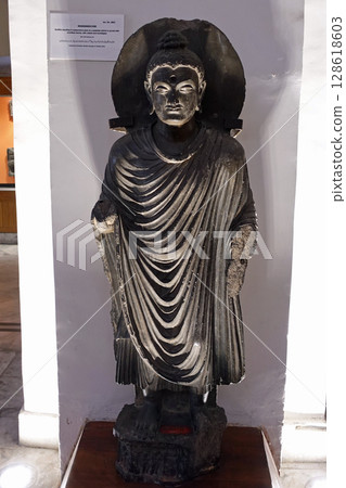A relief depicting a scene from the life of the Buddha from a Gandharan Buddhist sculpture on display at the museum in Peshawar, Pakistan. A relief depicting a scene from the life of the Buddha from a Gandharan Buddhist sculpture on display at the museum in Peshawar, Pakistan. 128618603