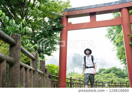 Torii gate and inbound tourists 128618660