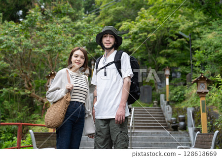 Inbound tourists standing on the approach to the shrine Inbound tourists standing on the approach to the shrine 128618669