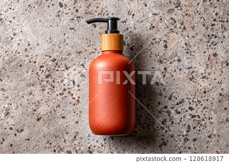 Terracotta Soap Refill Bottle Placed on Grey Speckled Countertop Terracotta Soap Refill Bottle Placed on Grey Speckled Countertop 128618917