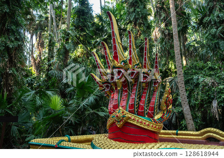 The 7 head Naga statue nearly holy well in Khamchanod forest a place where Thai people go there to worship the naga and ask for good health prosperity in life. 128618944