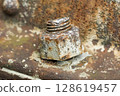 Close-Up of Rusted Railroad Bolt on Aging Track 128619457