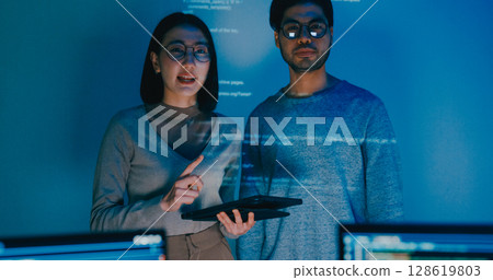 Group adult Asia male female software developers mentor leader manager talk strategy plan to executive write prompt AI bot IT app program nomad, video game, data center. Projecting slideshow code. 128619803