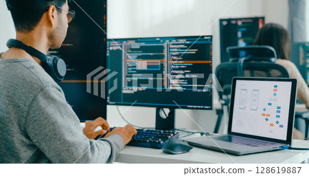 Closeup Adult Asia male, female freelance typing write prompt AI bot IT app smart program nomad, video game, terminal with coding language, user interface, designer, big data center desktop computer. 128619887