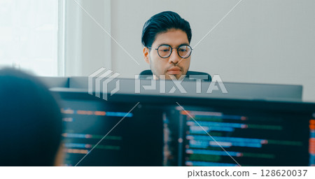 Closeup Adult Asia male, female freelance typing write prompt AI bot IT app smart program nomad, video game, terminal with coding language, user interface, designer, big data center desktop computer. 128620037