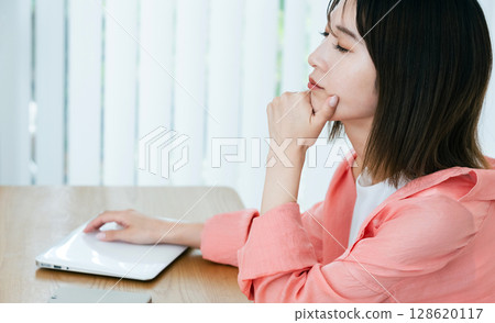 Digital-tired young woman Digital-tired young woman 128620117