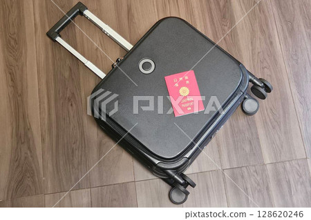 Passport and suitcase 128620246