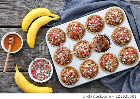 banana bread oat muffins with christmas sprinkles banana bread oat muffins with christmas sprinkles 128620591