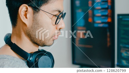 Closeup young adult Asia male freelance eyeglasses typing write prompt AI bot IT app program nomad, video game, terminal with coding, user interface, designer, big data center on desktop computer. Closeup young adult Asia male freelance eyeglasses typing write prompt AI bot IT app program nomad, video game, terminal with coding, user interface, designer, big data center on desktop computer. 128620799