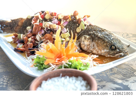 Fried Snakehead Fish in Spicy Herb Salad Fried Snakehead Fish in Spicy Herb Salad 128621803