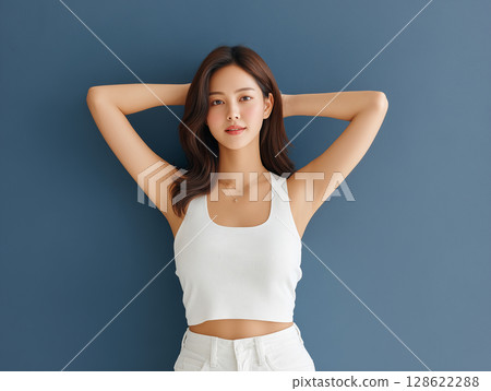 Full body photo of a beautiful woman posing with her arms raised Full body photo of a beautiful woman posing with her arms raised 128622288