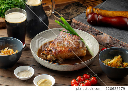 Pork knuckle with sauces cabbage and potatoes Pork knuckle with sauces cabbage and potatoes 128622679
