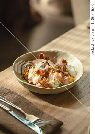 Bowl with salad, sliced roast beef and radish Bowl with salad, sliced roast beef and radish 128622688