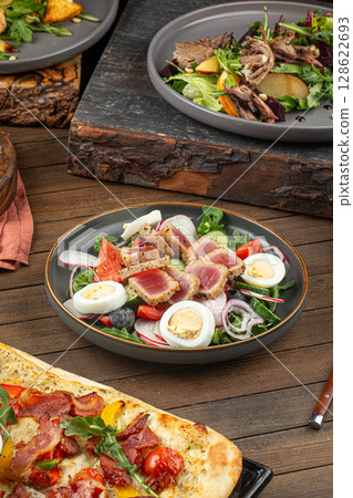Portion of nicoise salad with tuna fish and eggs 128622693