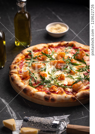 Shrimp and arugula pizza with cheese and sauce Shrimp and arugula pizza with cheese and sauce 128622726