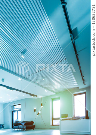 Modern white office with open space and large windows sun sunny light 128622751