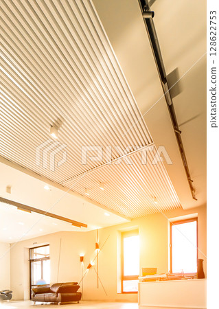 Modern white office with open space and large windows sun sunny light 128622753