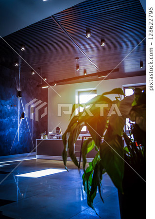 Office room with blank computer display,table,chair,cement floor,glass walls with night city view. Mixed media . 128622796