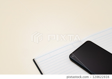 Open notebook and smartphone 128622816