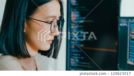 Closeup young adult Asia female freelance eyeglasses typing write prompt AI bot IT app program nomad, video game, terminal with coding, user interface, designer, big data center on desktop computer. Closeup young adult Asia female freelance eyeglasses typing write prompt AI bot IT app program nomad, video game, terminal with coding, user interface, designer, big data center on desktop computer. 128623017