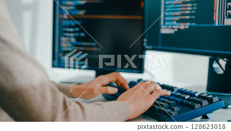 Closeup young adult Asia female freelance type write prompt AI bot IT app smart program nomad, video game, terminal with coding language, user interface, designer, big data center on desktop computer. 128623018