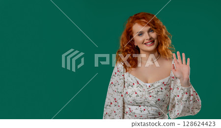 Copper woman natural curls waves hello, salute, chao, friendly smile on green Copper woman natural curls waves hello, salute, chao, friendly smile on green 128624423