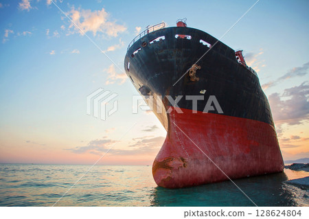 Large stranded cargo ship after a storm 128624804