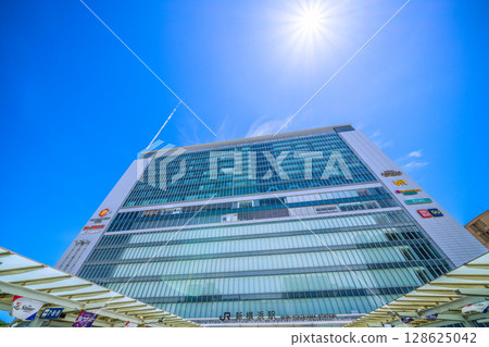 Yokohama cityscape in Japan: Inbound tourists... (bustling) Shin-Yokohama Station, airplane trails, the sun, etc. Towards a new era = July 19th 128625042
