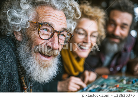 Joyful elderly friends enjoying board game together in cozy indoor setting with laughter 128626370