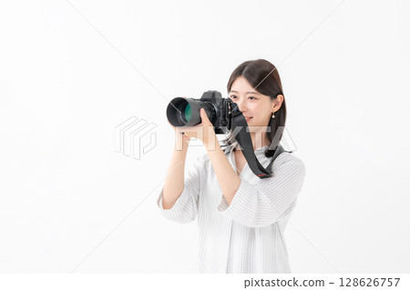 A woman with a camera 128626757