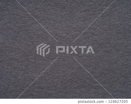 The textured charcoal gray felt. The textured charcoal gray felt. 128627205