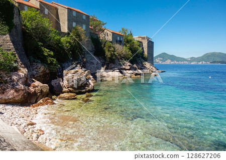 amazing Sveti Stefan beach in Budva riviera. Crystal clear waters on a sunny day 128627206