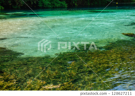 Turquoise and green water of river of Blue Eye Nature Monument near to Saranda, Albania Turquoise and green water of river of Blue Eye Nature Monument near to Saranda, Albania 128627211