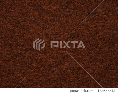 Rich mahogany felt texture, conjuring an ambiance of refined taste and timeless elegance. 128627218