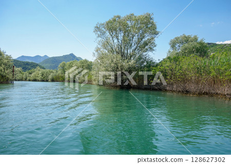 navigable canal in Lake Skadar or Lake Scutari, on the border of Albania and Montenegro 128627302