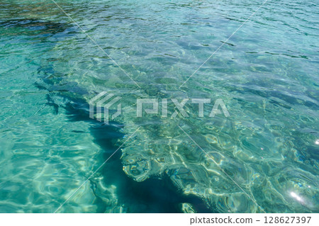 beautiful turquoise crystal clear water in shallow sea with coral reef beautiful turquoise crystal clear water in shallow sea with coral reef 128627397