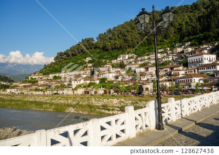 old Gorica bridge over Osum river in Berat, Albania. cityscape as backdrop old Gorica bridge over Osum river in Berat, Albania. cityscape as backdrop 128627438