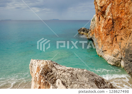 rocky edge of Gjipe Beach in Dhermi, Albanian riviera, Ionian sea rocky edge of Gjipe Beach in Dhermi, Albanian riviera, Ionian sea 128627498