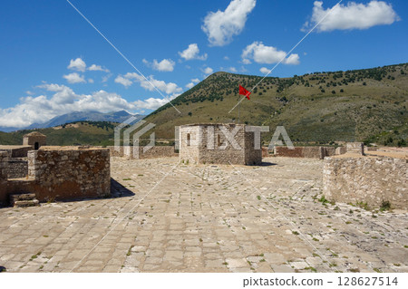 Albanian flag flying over tower in Porto Palermo Ali Pasha Castle, Himara, albanian riviera Albanian flag flying over tower in Porto Palermo Ali Pasha Castle, Himara, albanian riviera 128627514