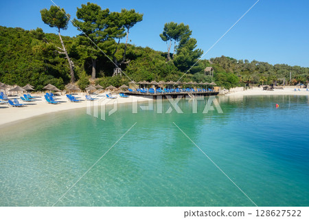 empty beach during spring season on Albanian riviera. Ksamil city empty beach during spring season on Albanian riviera. Ksamil city 128627522