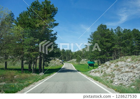 highway on a route in Lovcen Mountains near Cetinje and Kotor, Montenegro highway on a route in Lovcen Mountains near Cetinje and Kotor, Montenegro 128627530