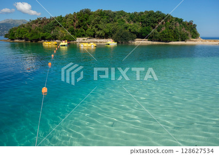 turquoise transparent waters of beach in Ksamil, Albanian rivieira turquoise transparent waters of beach in Ksamil, Albanian rivieira 128627534