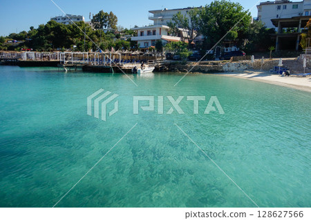 incredible paradise beach in Ksamil, Albanian rivieira, Ionian sea coastline incredible paradise beach in Ksamil, Albanian rivieira, Ionian sea coastline 128627566